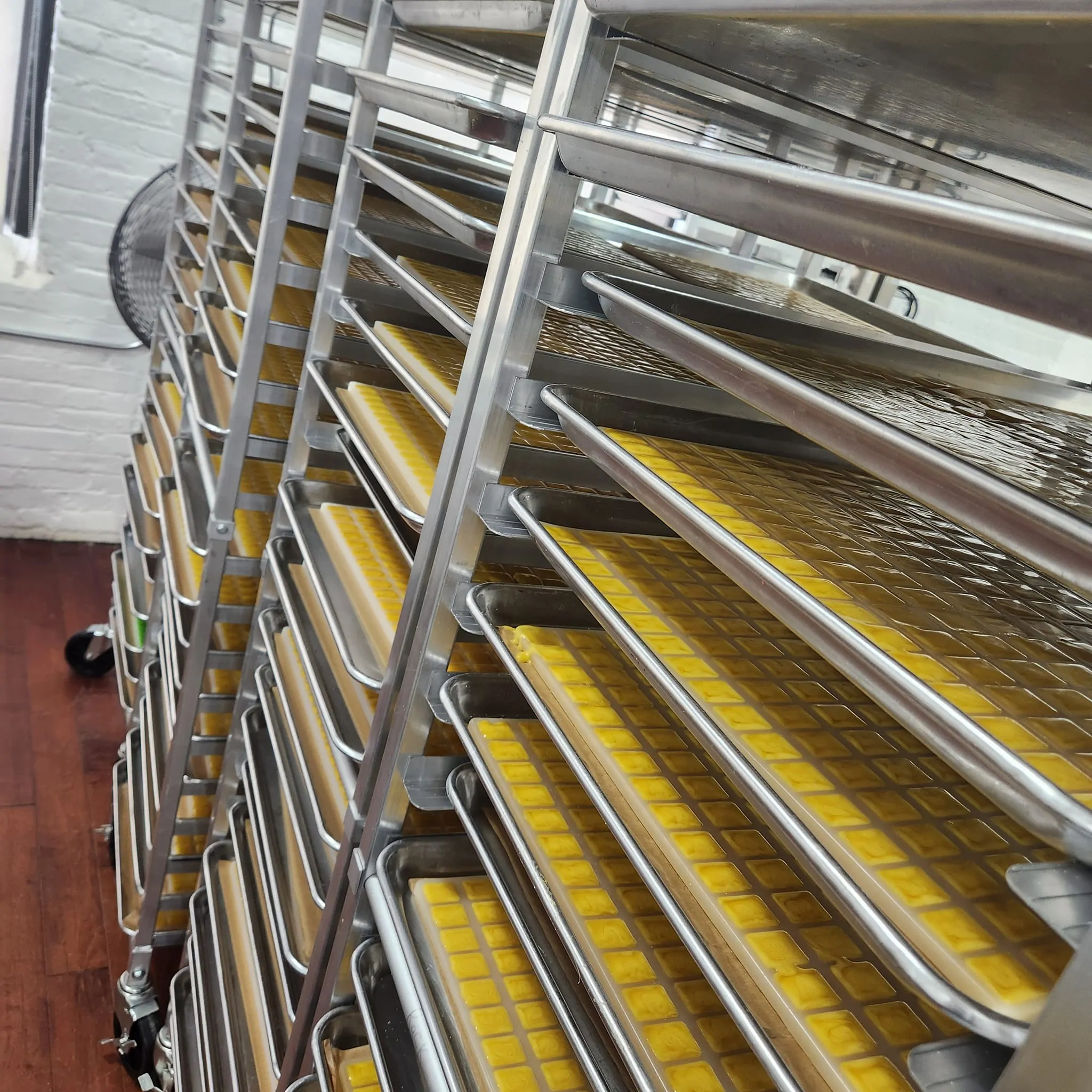 Cannabis edibles cooling on production racks
